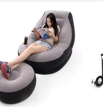 Inflatable seat with foot rest